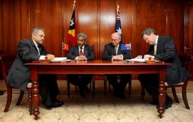 Prime Ministers Howard & Alkatiri, look on as new Timor Sea treaty is signed. 